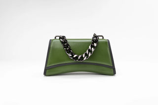 An olive green leather handbag with a black and white patterned chain handle, photographed
