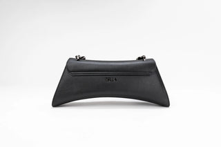 A black leather clutch bag with a curved silhouette, featuring a top flap and the brand name 'ISILA'