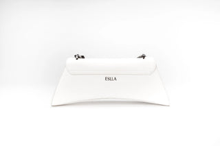 A white leather clutch bag with a curved bottom edge, featuring the brand name 'ESILA'