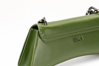 Close-up of an olive green leather handbag with silver-tone hardware and the brand name
