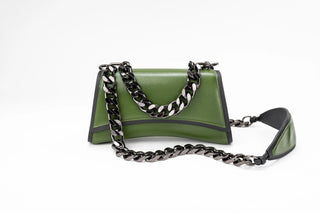 An olive green leather shoulder bag with a black and silver chain strap and a black leather
