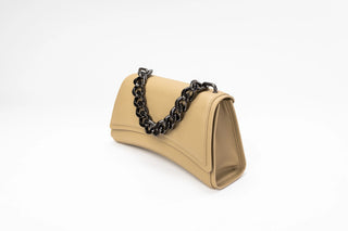 A beige leather shoulder bag with a black chain link strap, shown from a side angle on a white background.