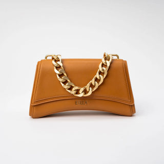 A tan leather shoulder bag with a prominent gold-tone chunky chain handle