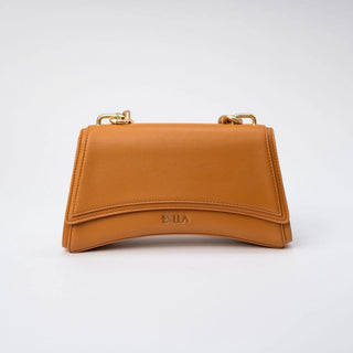A tan leather handbag with gold-tone hardware and a debossed 'BILA' logo on the front.