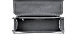 An open black leather clutch bag shown from a top-down view