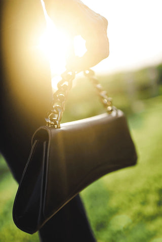 Model featuring Satori Clutch Matte color handbag