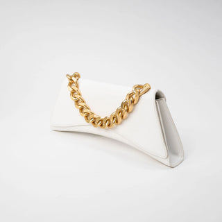 A white leather clutch bag with a prominent gold chain handle.