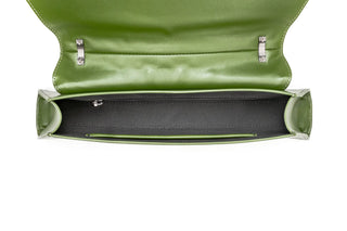 A top-down view of a green leather clutch or handbag, showing the open flap, silver-tone hardware